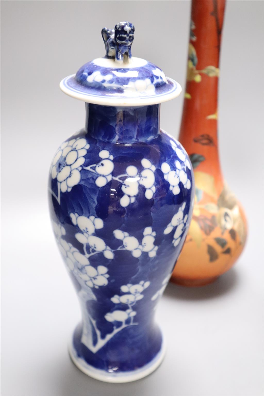 A Satsuma vase, 34cm, and two Chinese blue and white porcelain baluster jars and covers, all late 19th/early 20th century